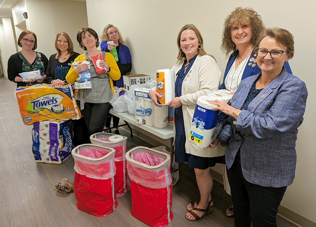 The ARSA Board is shown with items that were donated to the event charity, the Dorcas House in Little Rock.